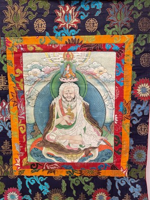 Lot 103 - Two Thangkas, Tibetan silk brocade with...