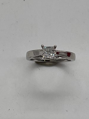 Lot 385 - A platinum and diamond solitaire ring, the...