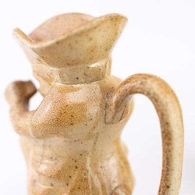 Lot 459 - FULHAM; a 19th century salt glazed Toby jug...