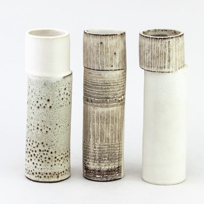 Lot 423 - A trio of cylindrical stoneware vases with...