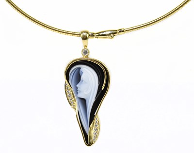 Lot 1313 - MELINA; a cameo pendant set within a yellow...