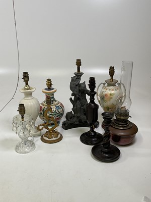 Lot 533 - Seven various lampbases, an oil lamp and an...