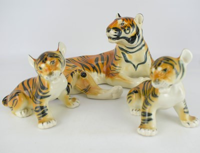 Lot 628 - USSR PORCELAIN; a resting tiger with two cubs,...