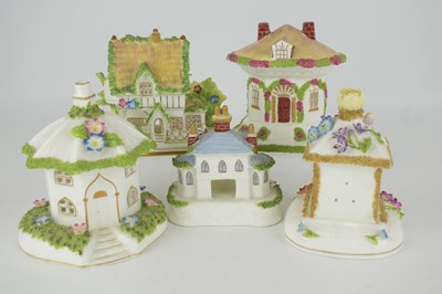 Lot 500 - COALPORT; five fine bone china cottages in the...