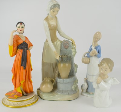 Lot 581 - Four collectible porcelain figures, comprising...