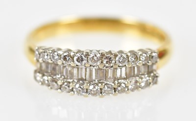 Lot 108 - An 18ct yellow gold and diamond baguette and...