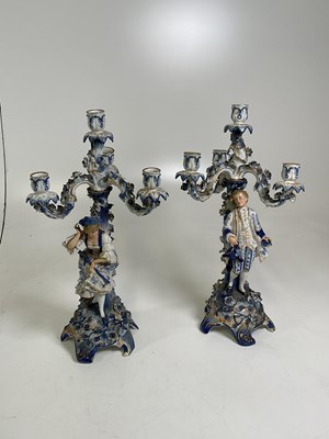 Lot 218 - A pair of Meissen candelabra, each with three...