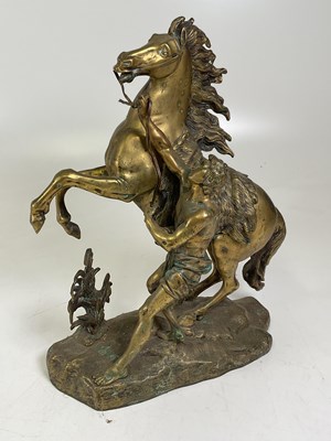 Lot 133 - AFTER COUSTOU; a brass sculpture of a Marly...