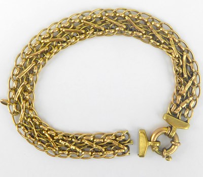 Lot 1068 - A 9ct gold mesh link bracelet with circular...