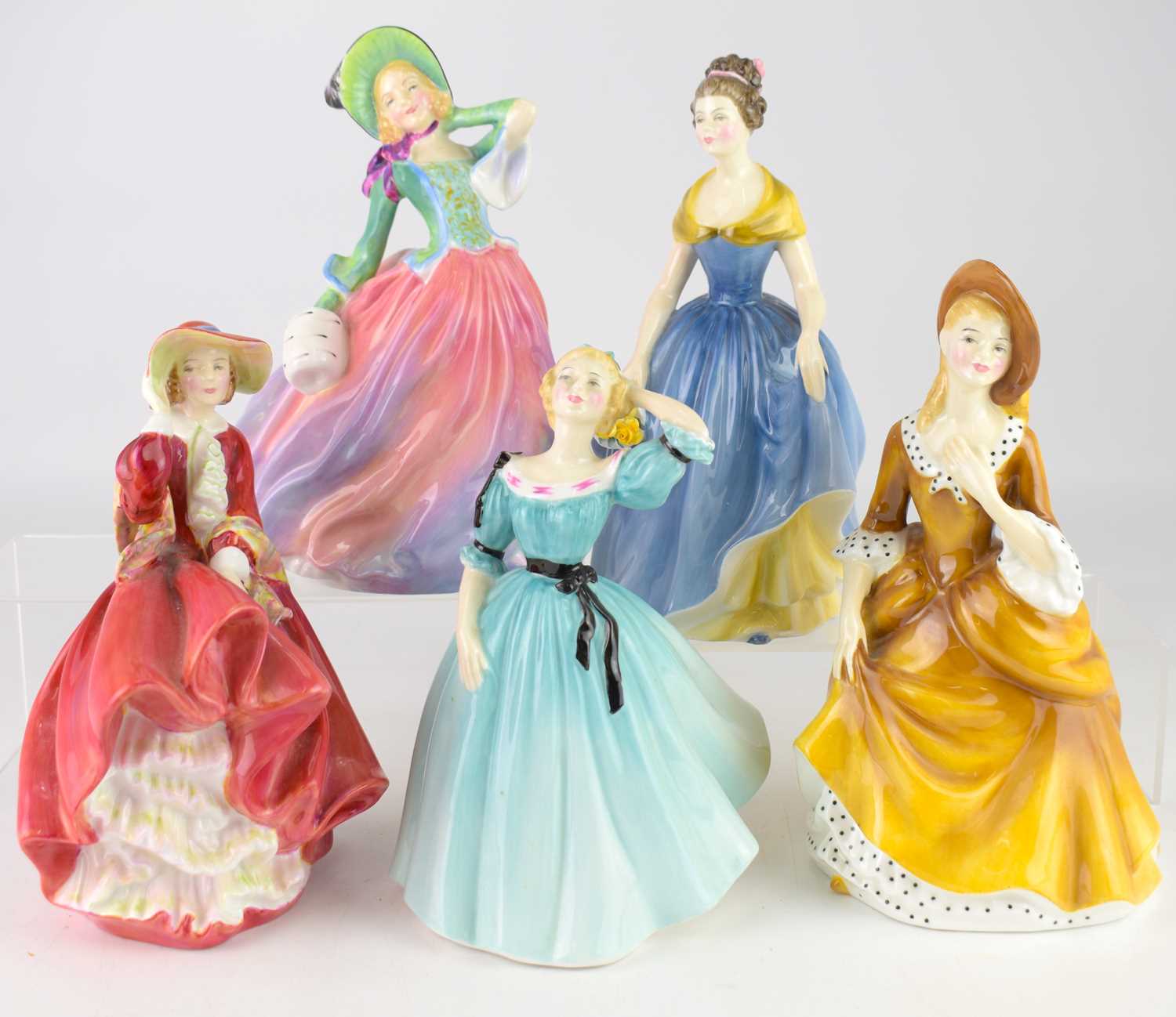 Lot 617 - ROYAL DOULTON; five figurines comprising...