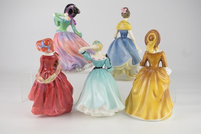 Lot 617 - ROYAL DOULTON; five figurines comprising...