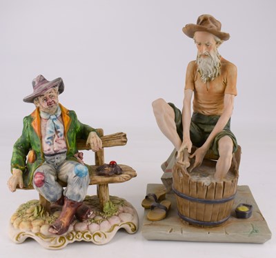 Lot 570 - CAPODIMONTE; two vintage porcelain figures...