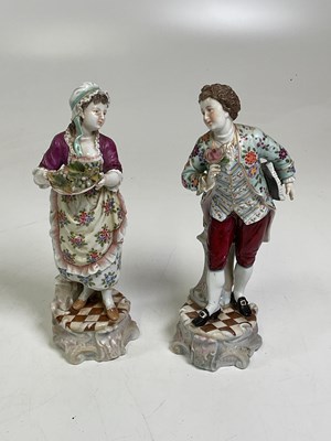 Lot 219 - A pair of Continental porcelain figures boy...