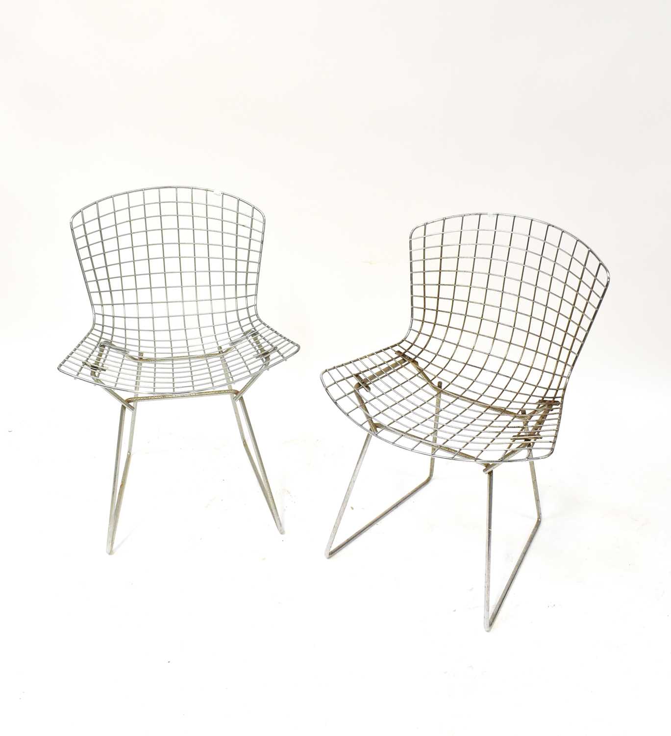 Lot 35 - HARRY BERTOIA; four wire chairs, with cream...