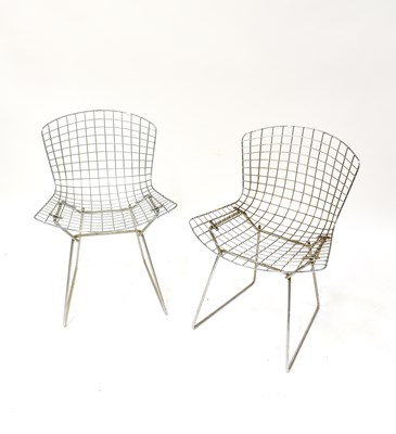 Lot 3 - HARRY BERTOIA; four wire chairs, with cream...