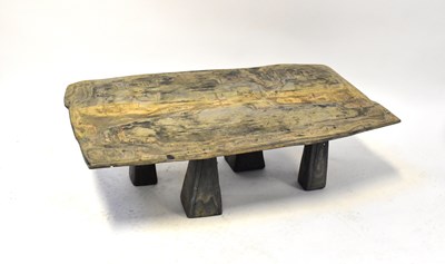 Lot 12 - A wooden topped ply coffee table with textured...