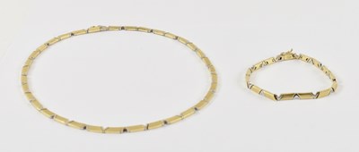 Lot 874 - A 14ct yellow and white gold necklace with...