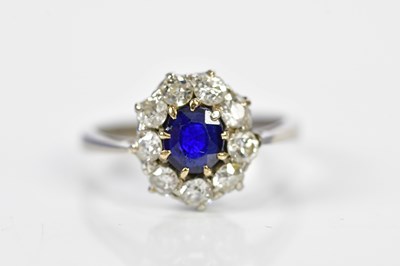 Lot 95 - An 18ct white gold sapphire and diamond oval...