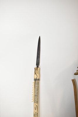 Lot 567 - A 20th century ceremonial bone mounted spear...