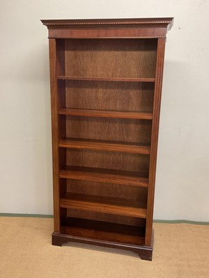 Lot 607 - A reproduction open bookcase with five...