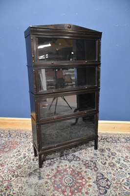 Lot 161 - MEOVOTO; an oak four section stacking bookcase,...