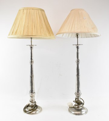 Lot 130 - A pair of modern stainless steel table lamps...