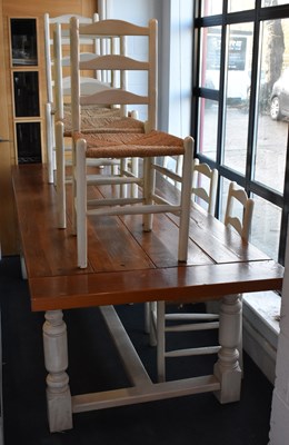 Lot 10 - A modern cream painted refectory table, with...