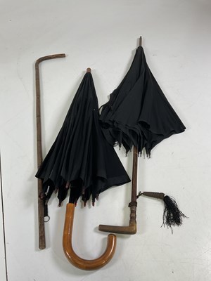 Lot 23 - Two vintage umbrellas and a walking stick (af).