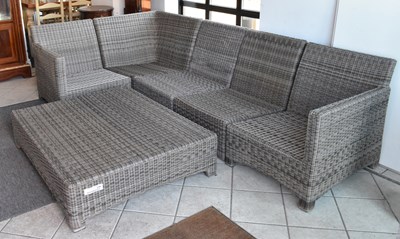 Lot 143 - A modern wickerwork L-shaped garden sofa with...