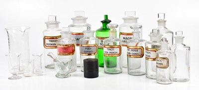 Lot 1384 - A collection of chemist jars, largest 24cm,...