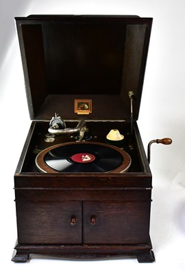 Lot 514 - HIS MASTER'S VOICE; an oak cased wind-up...