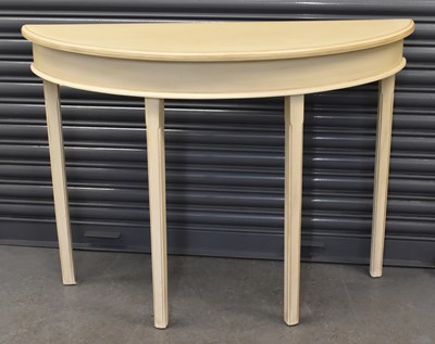 Lot 59 - A modern white painted demi-lune hall table,...