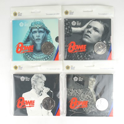 Lot 965 - ROYAL MINT; four David Bowie commemorative £5...