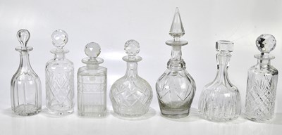 Lot 1494 - A collection of seven cut glass decanters,...