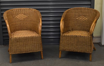 Lot 100 - A pair of modern wicker armchairs.