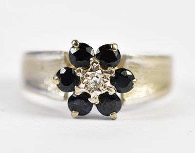 Lot 207 - An 18ct yellow gold flower head ring set with...