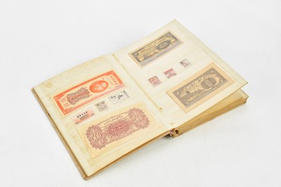 Lot 659 - An album of Chinese stamps and bank notes,...