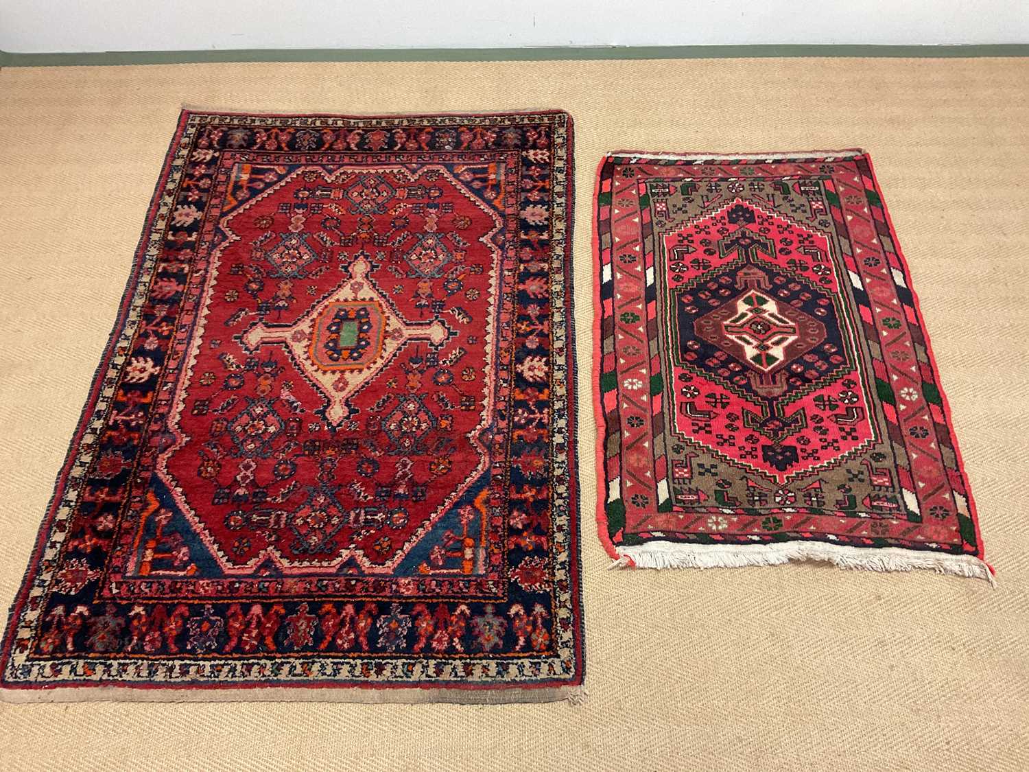 Lot 557 Two red Persian rugs, larger 155 x 107cm,