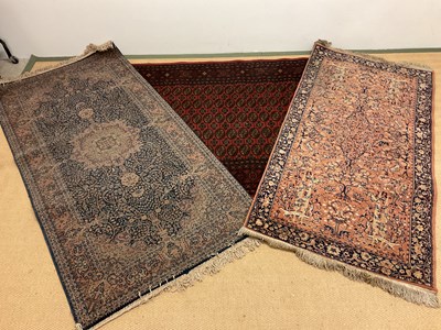 Lot 559 - Three Persian rugs, largest 188 x 132cm