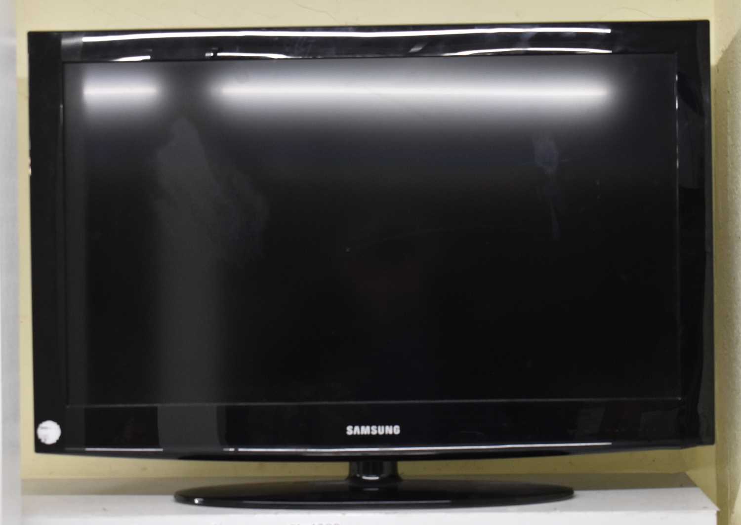 Lot 469 - A Samsung 31'' television with three remote