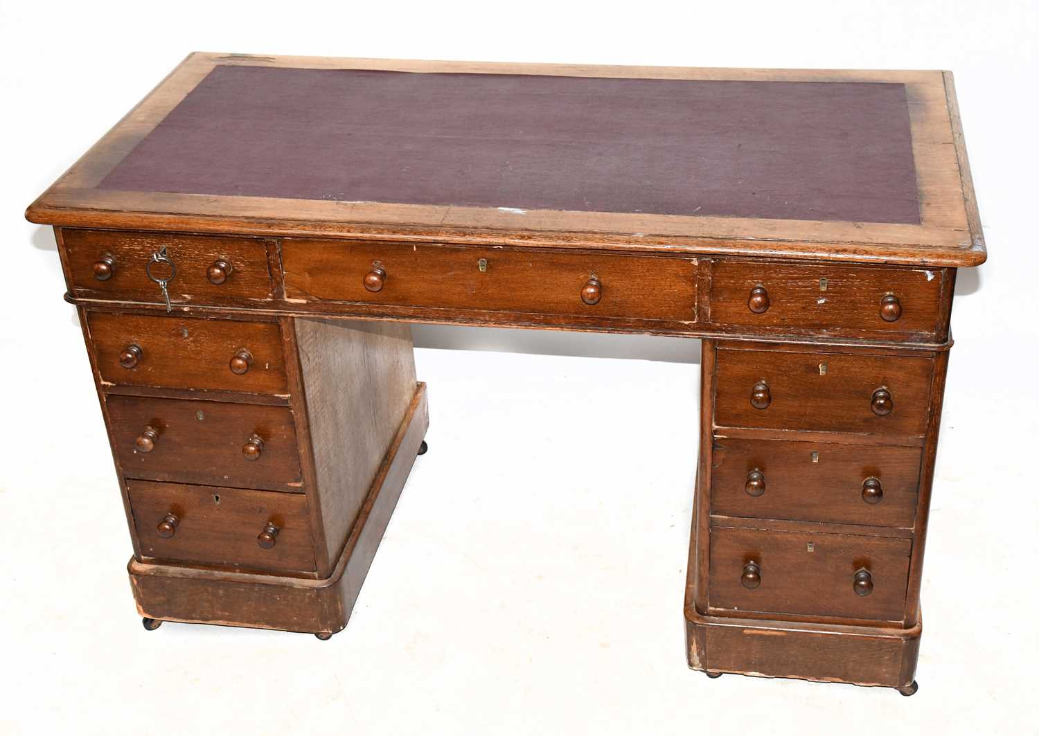 Lot 1653 - A late Victorian oak pedestal desk, with an...