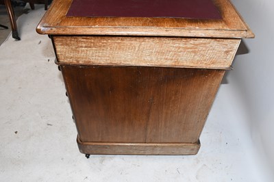 Lot 1653 - A late Victorian oak pedestal desk, with an...