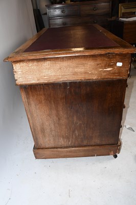 Lot 1653 - A late Victorian oak pedestal desk, with an...