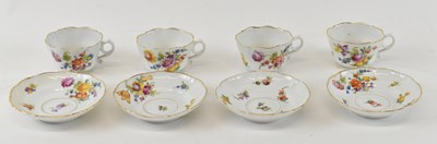 Lot 515 - A set of four floral decorated teacups and...