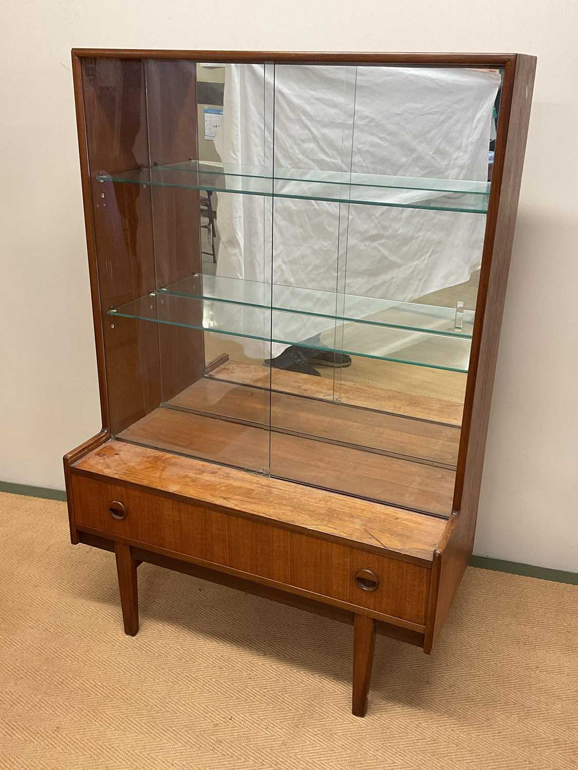 Lot 626 - TURNIDGE OF LONDON; a teak display cabinet,...