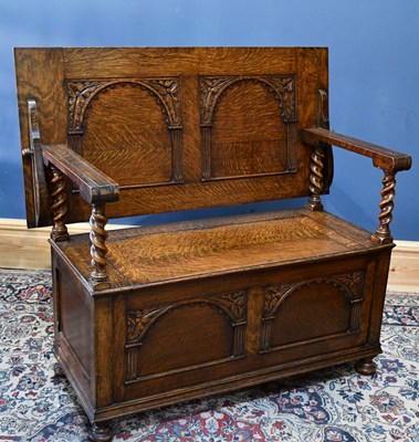 Lot 5 - A 1920s carved oak monk's bench, height 100cm,...