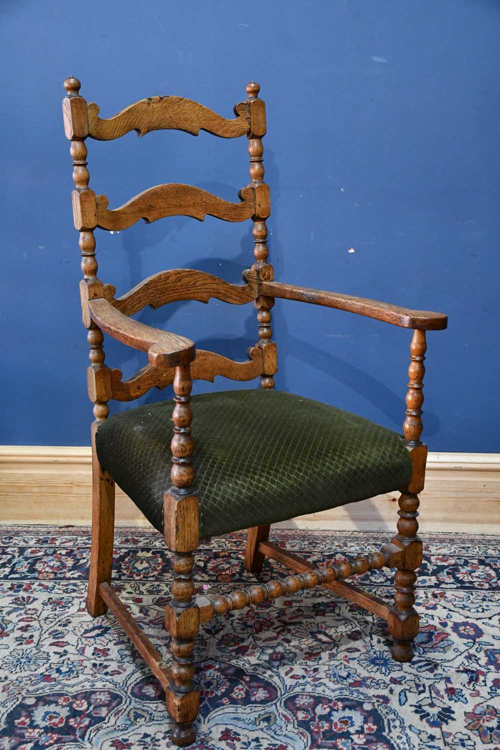 Lot 30 - A 19th century oak ladder back elbow chair,...