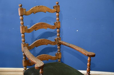 Lot 30 - A 19th century oak ladder back elbow chair,...