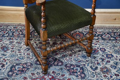 Lot 30 - A 19th century oak ladder back elbow chair,...