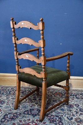 Lot 30 - A 19th century oak ladder back elbow chair,...